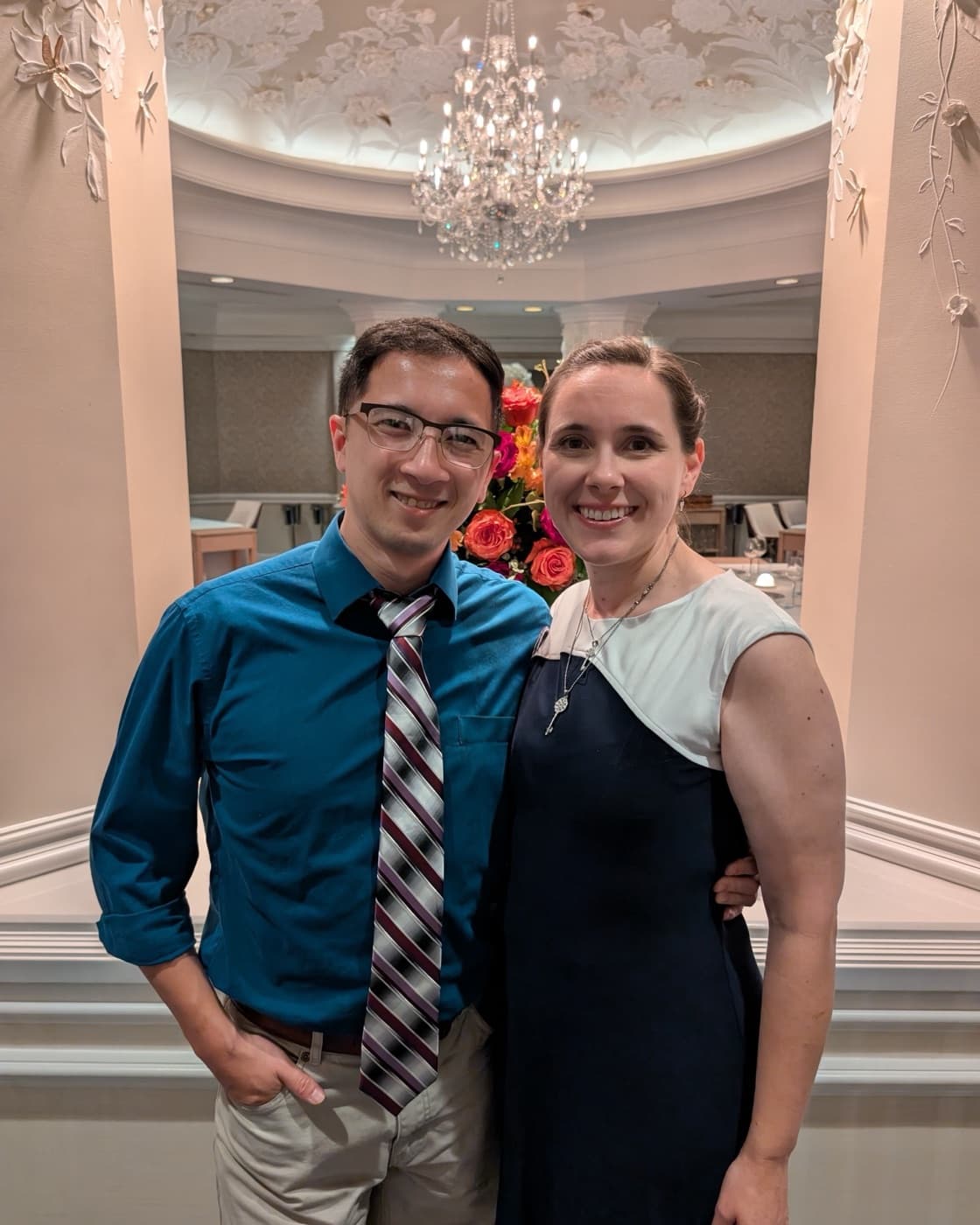 Kyle and Jillian Ng standing together, smiling, at an evening event